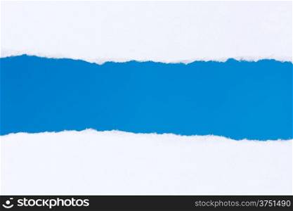 &#x9;Torn white paper with a blue background for your text.