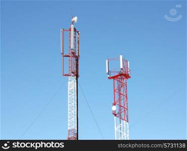 &#xA;Mobile telecommunication technology antenna (radio antenne) for wireless mobile phone connections on blue sunny sky. Electrical wireless equipment concept