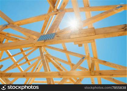 &#xA;New residential construction home framing against a sunny sky.