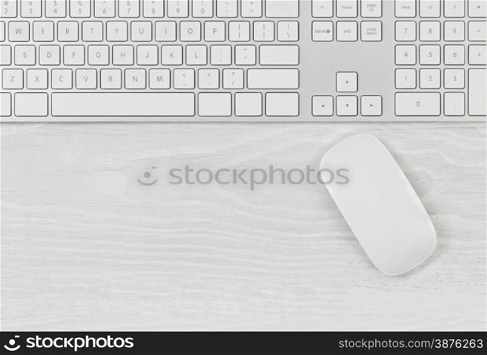 &#xA;White office table with computer keyboard and mouse. Top view with plenty of copy space.&#xA;