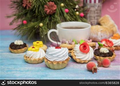 Xmas cookie on table. Tasty cookie on a fir-tree background for happy new year holiday