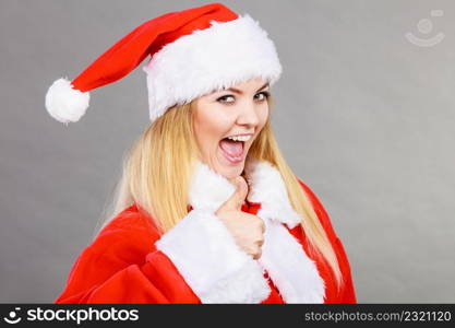 Xmas, seasonal clothing, winter christmas concept. Happy woman wearing Santa Claus helper costume. Happy woman wearing Santa Claus helper costume