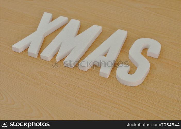 Xmas spelled with white polystyrene letters