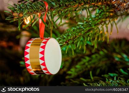 Xmas tree with a drum hanging from a branch