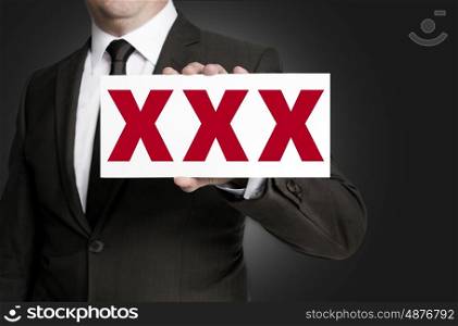 xxx sign is held by businessman background. xxx sign is held by businessman background.