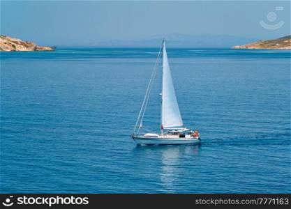 Yacht boat in blue waters of Aegean sea near Milos island , Greece. Yacht boat in Aegean sea near Milos island , Greece