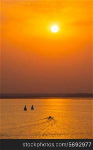 Yacht boats silhouettes in lake on sunset, India