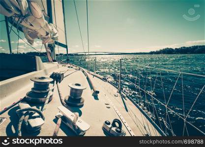 Yacht capstan with rope on sailing boat during cruise, marine objects concept.. Yacht capstan on sailing boat during cruise