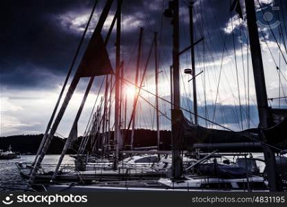Yacht harbor at night, beautiful luxury water transport in moonlight, yachting sport, marina in sunset light, summer vacation and traveling concept