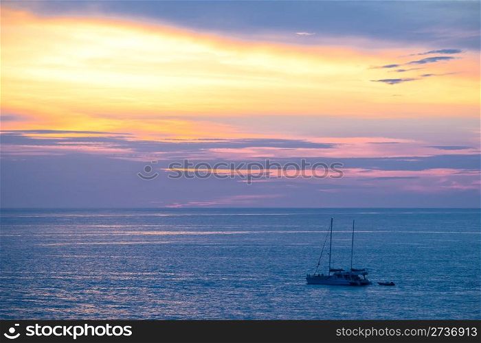 Yacht in a sea during sunset