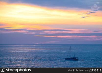 Yacht in a sea during sunset