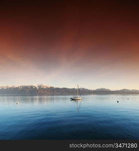 yacht in lake of geneva landscape on sunrise