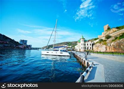 yacht in old port, sea in Crimea