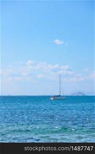 Yacht in the sea and blue sky with light clouds - Seascape