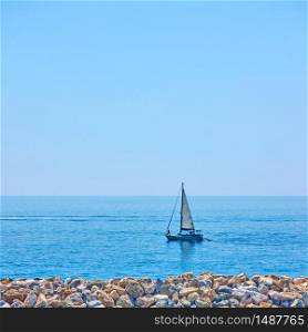 Yacht in the sea near coast on the summer day - Minimalistic seascape