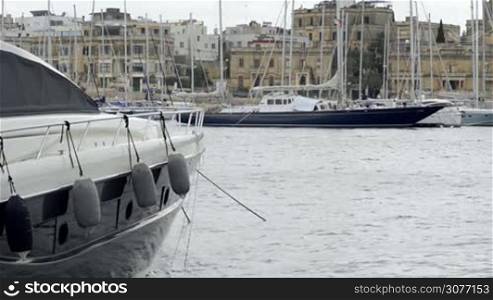 Yacht moored at Manoel Island Marina in Malta. View of sail boats in a row on docks at seaside harbor.