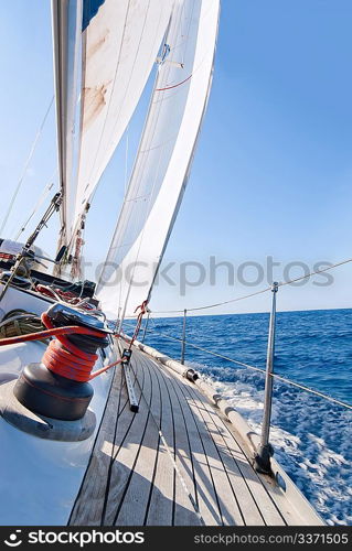 Yacht sailing in the sea in sunny day