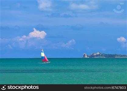 Yacht sailing in the sea in sunny day