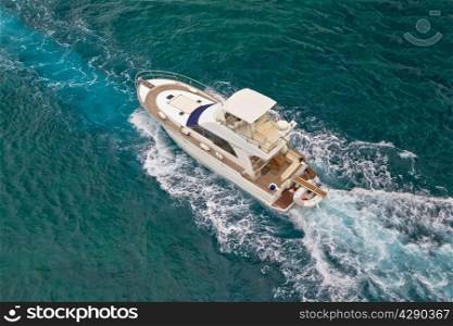 Yacht sailing on blue sea aerial view