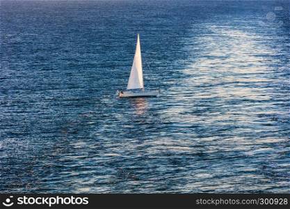 yacht with white sails in the sea