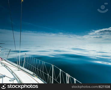 Yachting on sail boat during sunny summer weather on calm blue sea water. Sporty transportation conept.. Yachting on sail boat during sunny weather