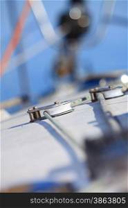 Yachting. Sailboat in the sea and ropes yacht detail