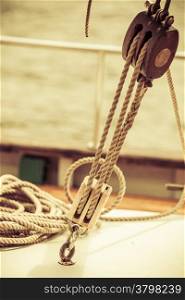 Yachting. Sailboat view of different parts of yacht, block with rope. Detail of a sailing boat