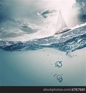 Yachting sport. Submerged ocean view with yacht floating above