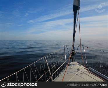 Yachting yacht sailboat sailing in baltic sea at evening summer vacation. Tourism luxury lifestyle.