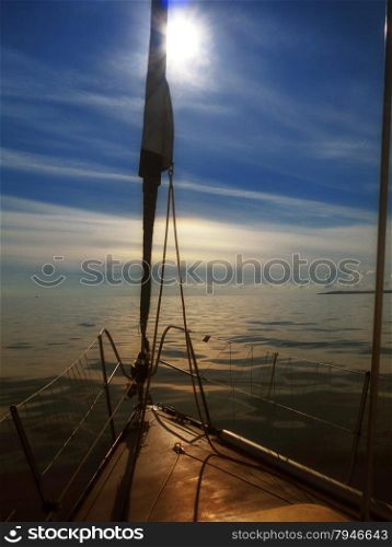 Yachting yacht sailboat sailing in baltic sea at sunset/ sunrise summer vacation. Tourism luxury lifestyle.