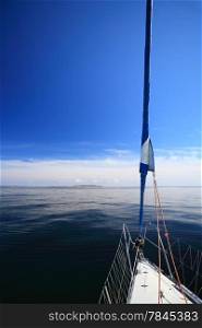 Yachting yacht sailboat sailing in baltic sea blue sky summer vacation. Tourism luxury lifestyle.