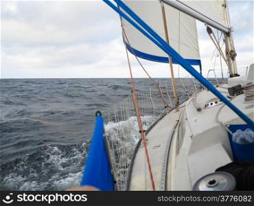 Yachting yacht sailboat sailing in baltic sea overcast sky summer vacation. Tourism luxury lifestyle.