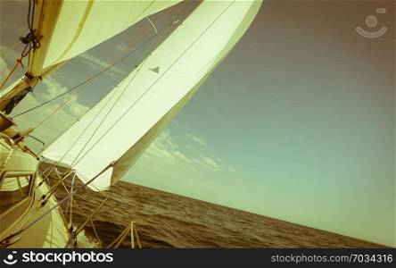 Yachting yacht sailboat sailing in baltic sea, summer vacation. Tourism luxury lifestyle. Toned image. Yachting yacht sailboat sailing in sea ocean