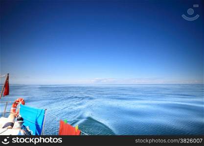 Yachting yacht sailboat under UK british ensign sailing in baltic sea blue sky sunny day summer vacation. Tourism luxury lifestyle.
