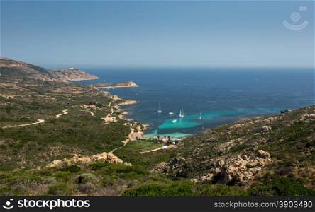 Yachts and boats moored in the turquoise gulf of Revellata in the Mediterranean near Calvi in Corsica