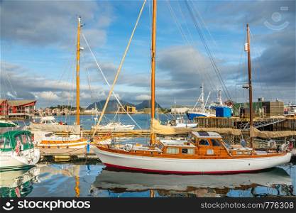 Yachts and boats with mountain in the background at pier in Svolvaer, Lototen islands, Austvagoya, Vagan Municipality, Nordland County, Norway