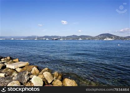 Yachts and sailboats moored in the Gulf of St Tropez, French Riviera.
