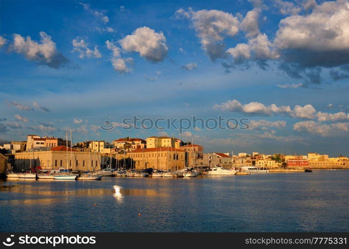 Yachts boats in picturesque old port of Chania is one of landmarks and tourist destinations of Crete island in the morning. Chania, Crete, Greece. Yachts and boats in picturesque old port of Chania, Crete island. Greece