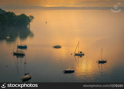 Yachts in the Early Morning Mist at Lesa Lake Maggiore