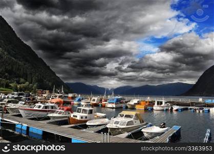 Yachts standing in marina in Norwegian fjord