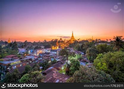 Yangon skyline at twilight with Shwedagon Pagoda  in Myanmar