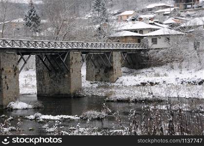 Yantra river, Vladishki bridge and residential area in the town of Veliko Tarnovo in Bulgaria in December