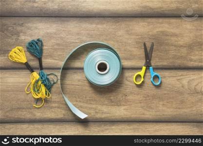 yarn thread ribbon scissor wooden backdrop