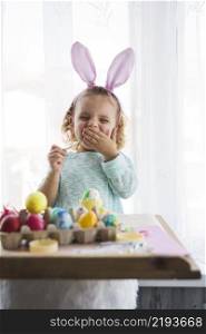 yawning girl coloring eggs