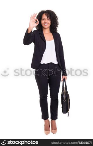 Yeah! All ok!. Young african business woman signaling ok, isolated over white background