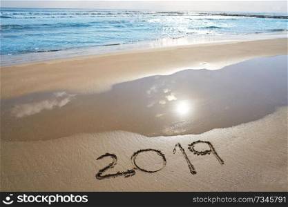 year 2019 numbers spell written on beach sand shore