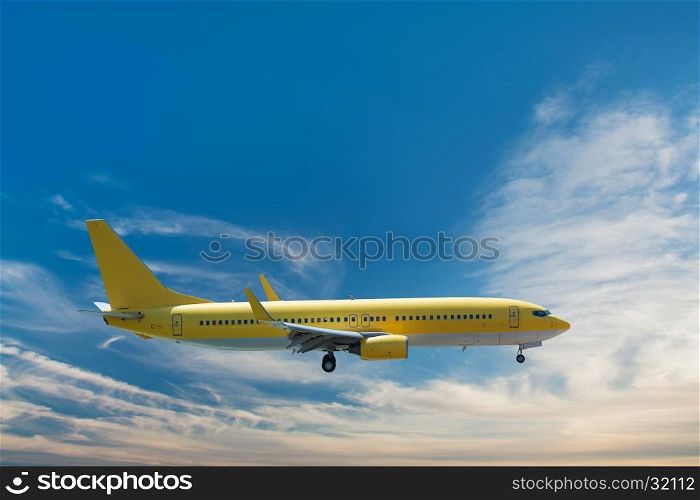 Yellow airplane landing on blue sky background