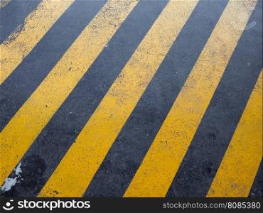 Yellow and black stripes. Yellow and back striped texture useful as a background