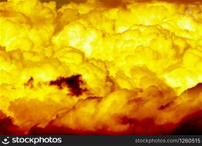 yellow and orange burn dramatic cumulonimbus clouds. hot atomic mushroom cloud very light