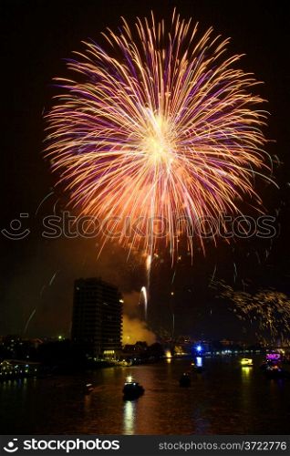 Yellow and violet firework over Chaophraya river Bangkok on Father&rsquo;s day,Bangkok Thailand